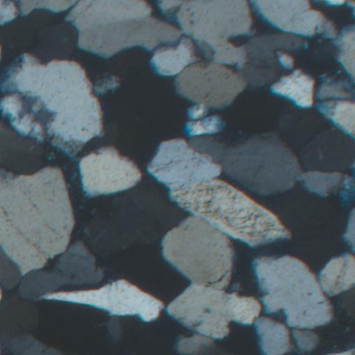 A representative thin-section crop showing dense, irregular grain boundaries